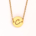 Macro detail of gold coin pendant with hollow letter C and delicate O-chain necklace - Letter C