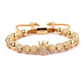Macro detail of gold crown bracelet featuring micro-pave zircons and adjustable cord - Single Style B
