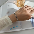 Silver bracelet with deep blue rectangular stones and white diamonds on a female wrist - Double Row Black