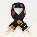 Detail of jacquard heart pattern on wide nylon strap with golden lobster clasps - No. 30 + Gold Hook (Black with Purple/Gold Heart)