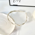 Elegant twisted acetate headband with cream marble texture and fine braided design - Light Beige