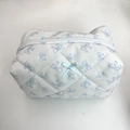 White quilted makeup bag with blue ribbon bow print and central 3D bow decoration - Light Blue Hollow Bow