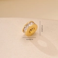 Close-up of a 7mm gold-plated round spacer bead with cubic zirconia for DIY jewelry - Gold Round Single Row Zirconia