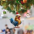 Christmas rooster ornament with red hat hanging on tree with festive decorations - Rooster on Christmas Tree Decor