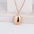 Polished rose gold oval locket necklace on stone background for women - Oval Smooth 24*16/Rose Gold