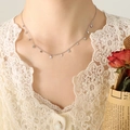 Silver multi-star pendant choker necklace in titanium steel for women on model - Steel Star Style