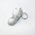 Mini canvas sneaker keychain in white with classic rubber toe and silver metal ring - White