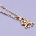 Spider pendant necklace crafted in 18k gold plated stainless steel on purple background - Necklace / Gold