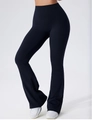 Side view of black high-waisted flare yoga pants showing slim fit and wide waistband - S / Black
