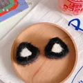 Cute plush triangular hair clips in black and white resembling fuzzy onigiri snacks - Black Pointed Ears (1 Pair)