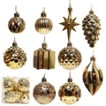 Assorted gold electroplated Christmas ornaments including stars, pinecones, and textured balls - Gold