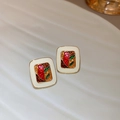 Vintage gold-framed earrings with cream base and colorful abstract enamel glaze - Colorful Glazed Abstract Vintage Studs