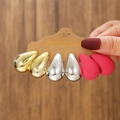 Detailed macro view of three pairs of water drop earrings in gold, silver, and matte rose red - Gold Silver Rose Red (E0156-1)