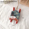 Wooden Christmas sled ornament with snowman Joy pattern and hanging rope, 9x5cm size - Wooden Sled Snowman