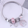 Silver tree of life charm bracelet with pink enamel flower beads and sparkling crystals - Pink