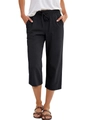 Detail of black cotton linen trousers showing elastic drawstring waist and large front pockets - S / Black