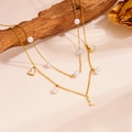 Double-layer gold stainless steel necklace with white pearls and heart pendant on wood - Heart Style (D311)