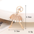 Detail shot of golden ballet dancer brooch with white rhinestones showing 4.8cm height - D365 Full Rhinestone Dancer (Gold)