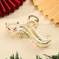 Detail of golden fox shark clip with red enamel eyes and elegant white pearls - Golden Cute Fox Hair Claw