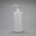 500ml translucent plastic squeeze bottle with curved nozzle and scale markings - 1000ml (Clear)