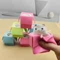 Pink silicone squeeze toy shaped like a cube with a cute white kitten popping out - Box Cat Squeeze Toy