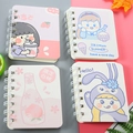 Mini A7 spiral notebooks featuring four colorful cartoon girl designs on a pastel background - Snack Girl