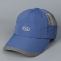 Detail of navy quick-dry baseball cap featuring breathable grey mesh and embroidered mad logo - M (56-58cm) / Blue