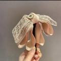 Beige ribbon bow hair clip with gold lace, pearls, and a vertical banana clip closure - Champagne Ponytail Clip