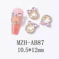 Macro detail of MZH-AB87 bowknot smile nail art charm with aurora heart rhinestones - Starry Pink (AB87)