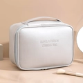 Silver PU leather cosmetic bag with double zippers and handle for travel and makeup storage - Handheld Large / Silver