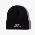 Classic black knit beanie featuring white In My Eras Era embroidery on a plain white backdrop - One Size / Black