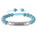 Detailed macro of turquoise style beads with adjustable light blue cord and custom silver tag - Turquoise