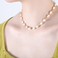Baroque freshwater pearl necklace with gold spacer beads on a female model neck - 38+8cm / Gold