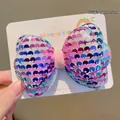 Girl's hair clip featuring a 6cm sparkling blue and pink sequin bow on a white display card - Blue Pink Bow (Hair Clip)