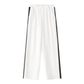Detail of white wide-leg trousers featuring contrasting black side stripes and button waist - S / White And Black Patchwork Wide Leg Trousers