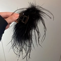 Close-up of elegant black ostrich feather hair claw clip showcasing soft texture and detail - Hair Claw / Black