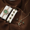 Golden quartz watch and jewelry set with green heart-shaped gemstones on silk background - Light Gold Green Heart Rhinestone Set