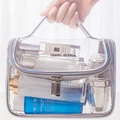 Holographic PVC makeup bag with grey handle and Travel Season text on clear plastic - Holographic Silver PVC