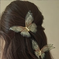 Set of two grey-green translucent butterfly hair clips with pearls on model hair - Gauze Butterfly Style (F0006) / Ink Gray
