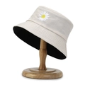 Beige daisy embroidery bucket hat with black lining on a wooden stand - One Size / Deep Beige