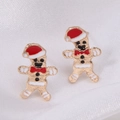 Festive gingerbread man earrings with red hat and enamel finish on white silk background - Drip Oil Snowman with Star
