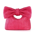 Magenta woven straw handbag for women featuring a large decorative bow handle - Rose Red