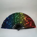 Macro detail of folding fan featuring black ribs and vibrant rainbow gradient polka dot fabric - Rainbow Polka Dot Gradient A4
