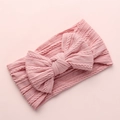 Detail of baby cable knit nylon headband with large bow in soft pink color - Deep Pink