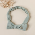 Detail of baby cotton headband showing Morandi blue fabric texture and teepee print - Green Tent