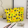 Detailed view of quilted cotton cosmetic bag with colorful cartoon bear pattern - Bears on Yellow