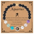 Aquarius zodiac bracelet with black beads, gold star charm and natural stone accents - Aquarius