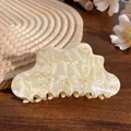 Acetate hair claw clip with cream marble texture and wavy design for elegant hair styling - Off-white