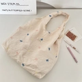 Detail of embroidered colorful bows on a beige waffle texture canvas tote bag - Beige