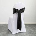 White stretch chair cover featuring a large decorative black satin bow tie accent - Black